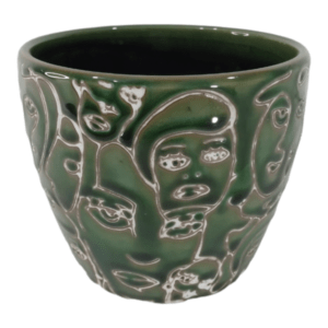 Small White Faces On Green Ceramic Pot